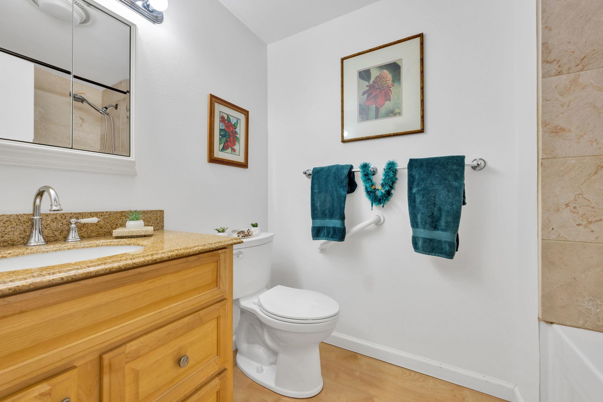 2747 South Kihei Road, Unit C205 Kihei, HI 96753 - Photo 22 of 49 a bathroom with a toilet sink and mirror