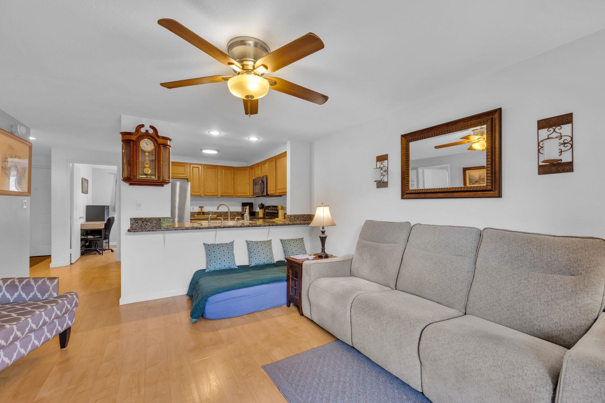 2747 South Kihei Road, Unit C205 Kihei, HI 96753 - Photo 28 of 49 a living room with furniture kitchen view and a chandelier