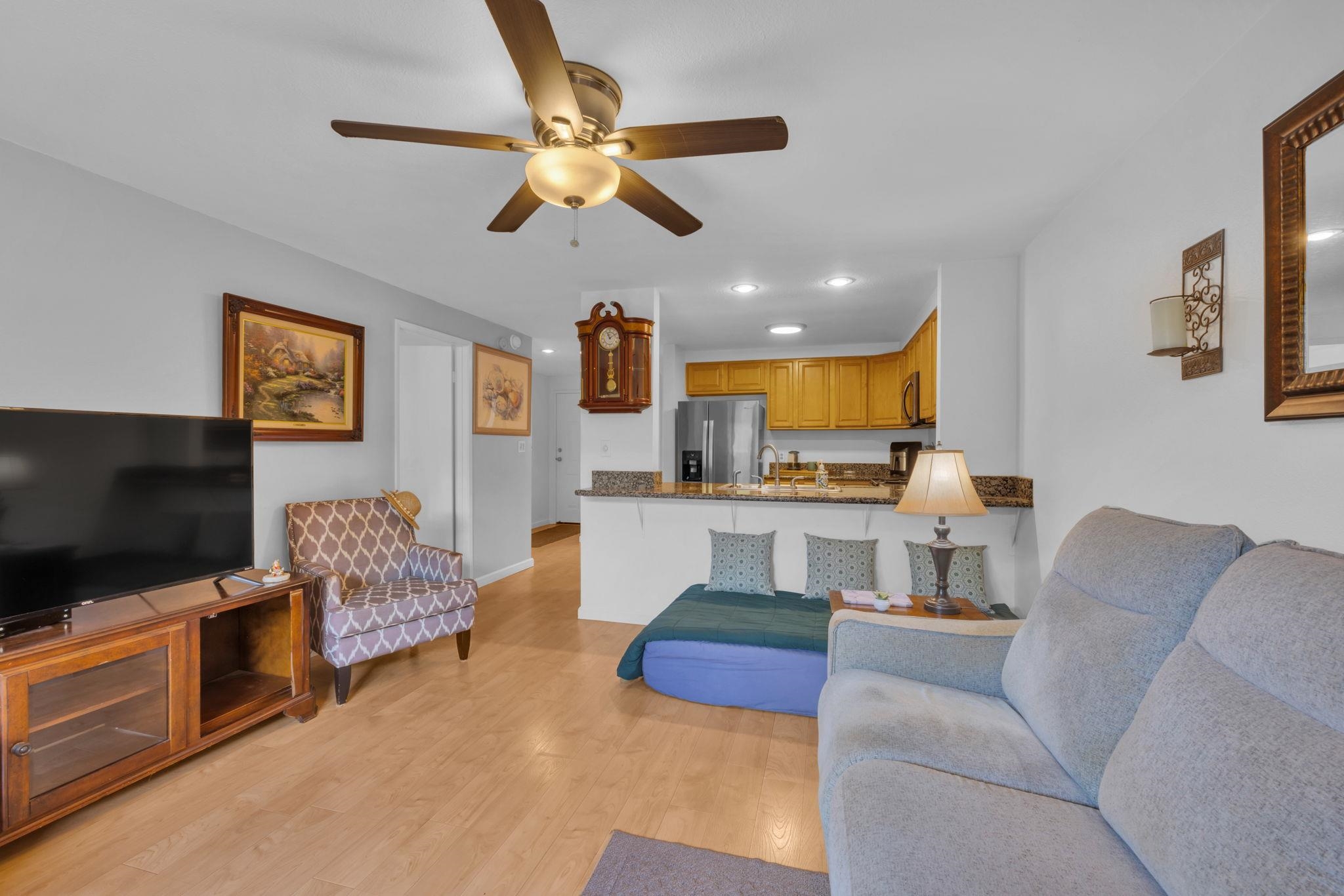 2747 South Kihei Road, Unit C205 Kihei, HI 96753 - Photo 29 of 49 a living room with furniture and a flat screen tv