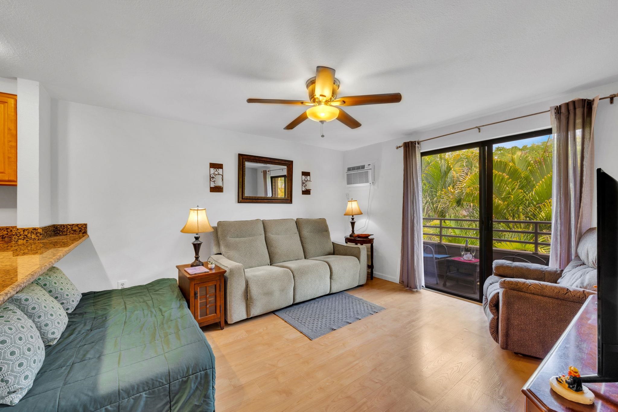 2747 South Kihei Road, Unit C205 Kihei, HI 96753 - Photo 3 of 49 a living room with furniture and a large window