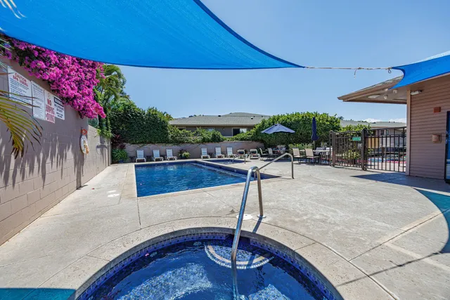 a view of a swimming pool with a patio