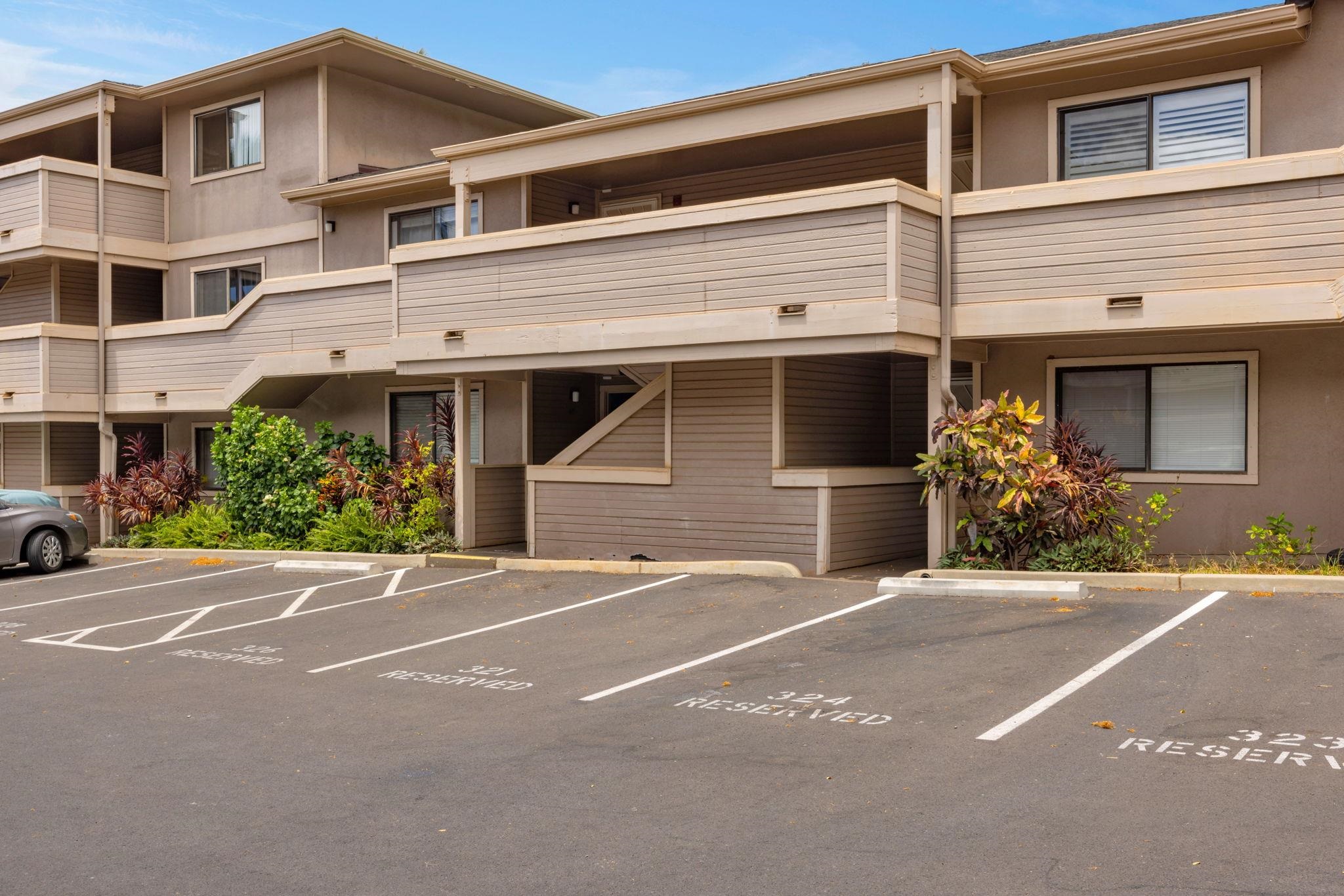 2747 South Kihei Road, Unit C205 Kihei, HI 96753 - Photo 47 of 49 a front view of a house with lots of trees