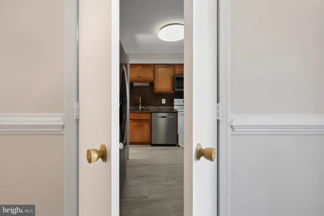 a view of a kitchen from the hallway