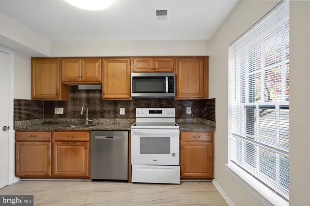 a kitchen with a stove and a microwave