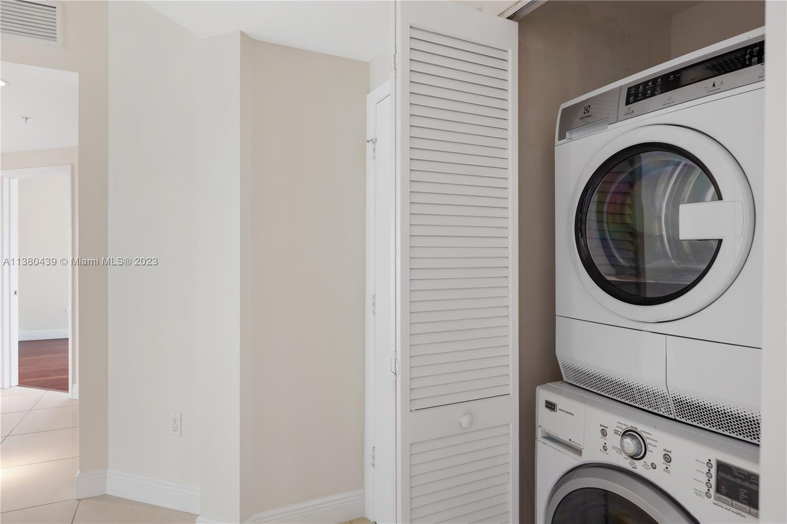 7290 Southwest 90th Street, Unit F606 Miami, FL 33156 - Photo 14 of 17 a utility room with dryer and washer