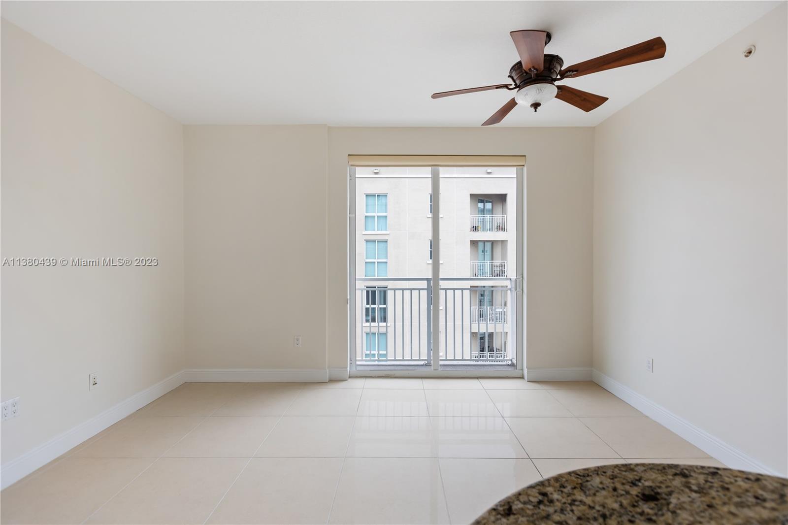 7290 Southwest 90th Street, Unit F606 Miami, FL 33156 - Photo 5 of 17 an empty room with windows