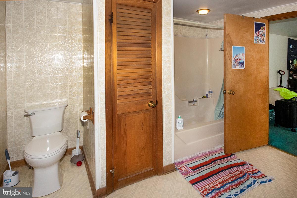 8 Franklin Road Glassboro, NJ 08028 - Photo 11 of 40 a bathroom with a toilet and a shower