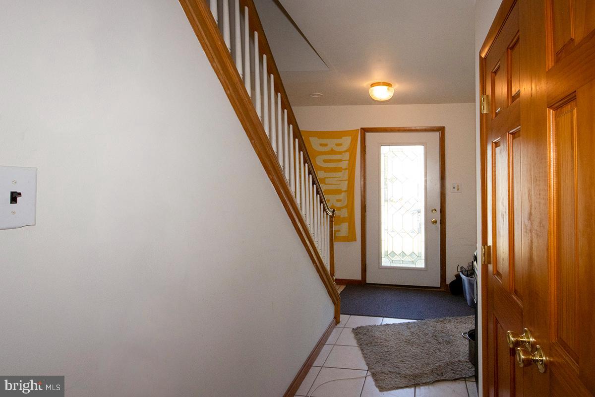 8 Franklin Road Glassboro, NJ 08028 - Photo 14 of 40 a view of a hallway with entryway and stairs