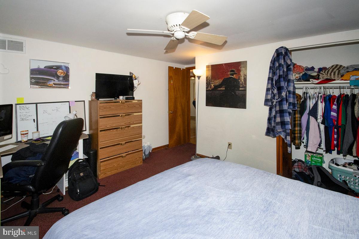 8 Franklin Road Glassboro, NJ 08028 - Photo 16 of 40 a bedroom with a bed and a flat screen tv