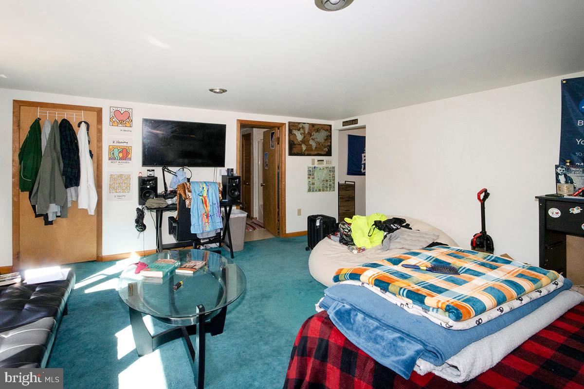 8 Franklin Road Glassboro, NJ 08028 - Photo 18 of 40 a bed room with furniture and a flat screen tv