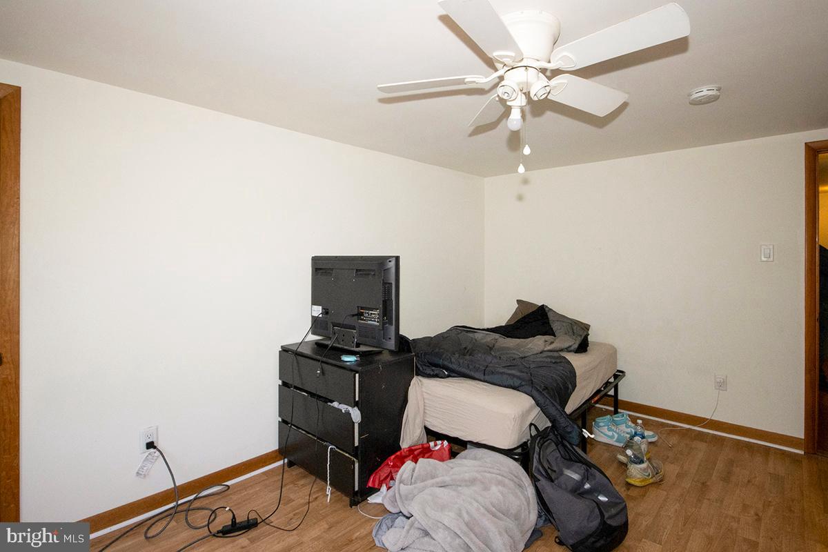 8 Franklin Road Glassboro, NJ 08028 - Photo 21 of 40 a bedroom with a bed and a potted plant