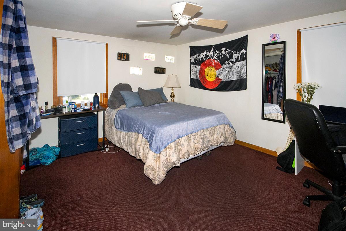 8 Franklin Road Glassboro, NJ 08028 - Photo 23 of 40 a bed room with a bed and a painting on the wall