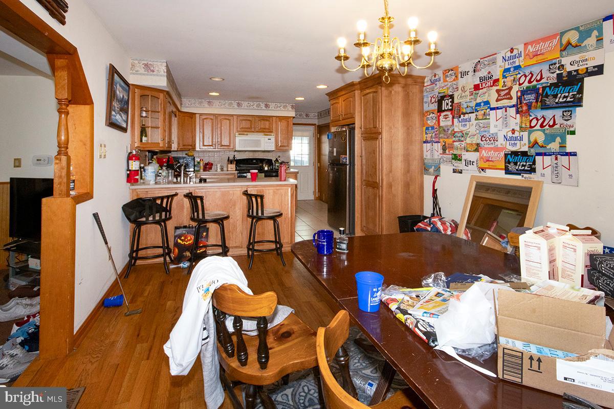 8 Franklin Road Glassboro, NJ 08028 - Photo 31 of 40 a outdoor dining space with furniture and a chandelier
