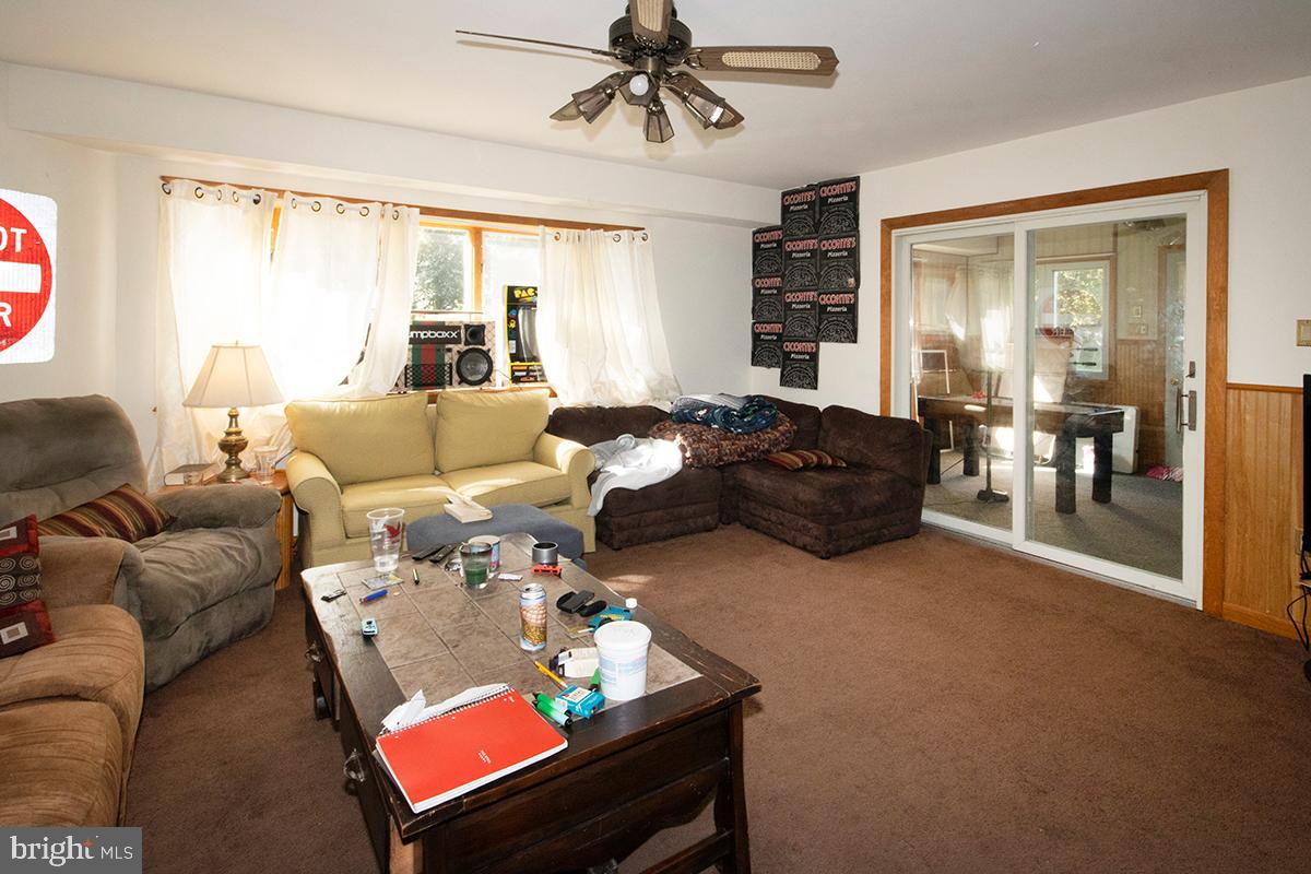 8 Franklin Road Glassboro, NJ 08028 - Photo 35 of 40 a living room with furniture a window and a chandelier
