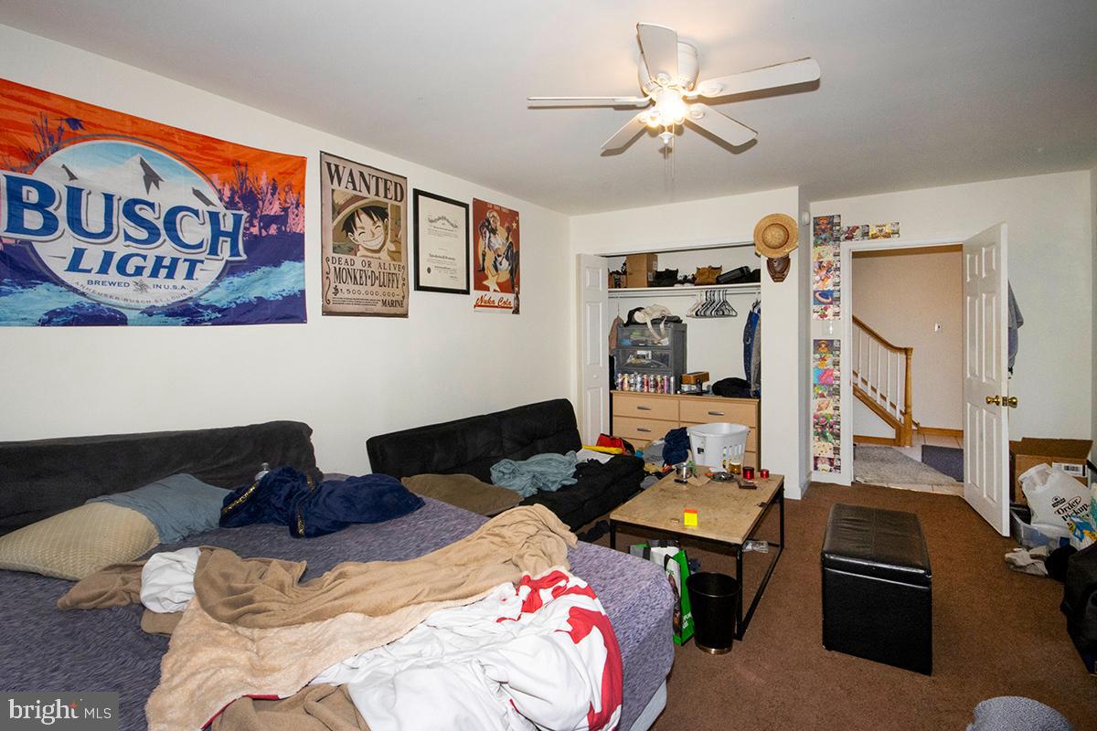 8 Franklin Road Glassboro, NJ 08028 - Photo 36 of 40 a bedroom with furniture and a chandelier