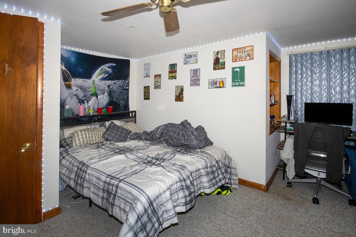 8 Franklin Road Glassboro, NJ 08028 - Photo 9 of 40 a bedroom with a bed and a flat screen tv