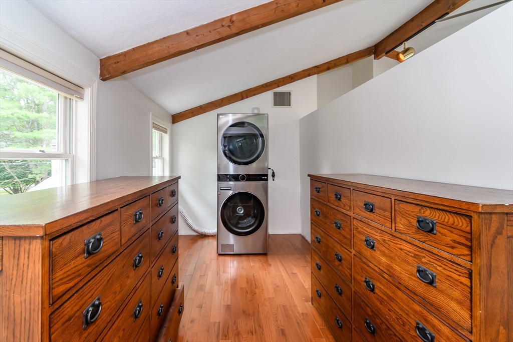 124 Everett Street Natick, MA 01760 - Photo 25 of 36 a view of a hallway with washer and dryer