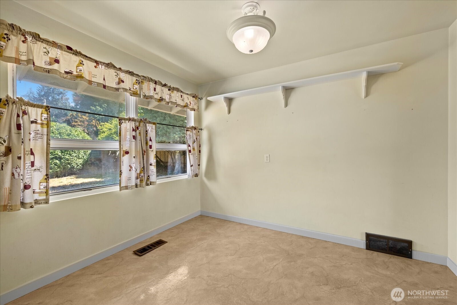 9125 Meadow Way Everett, WA 98208 - Photo 18 of 27 a view of an empty room with a window