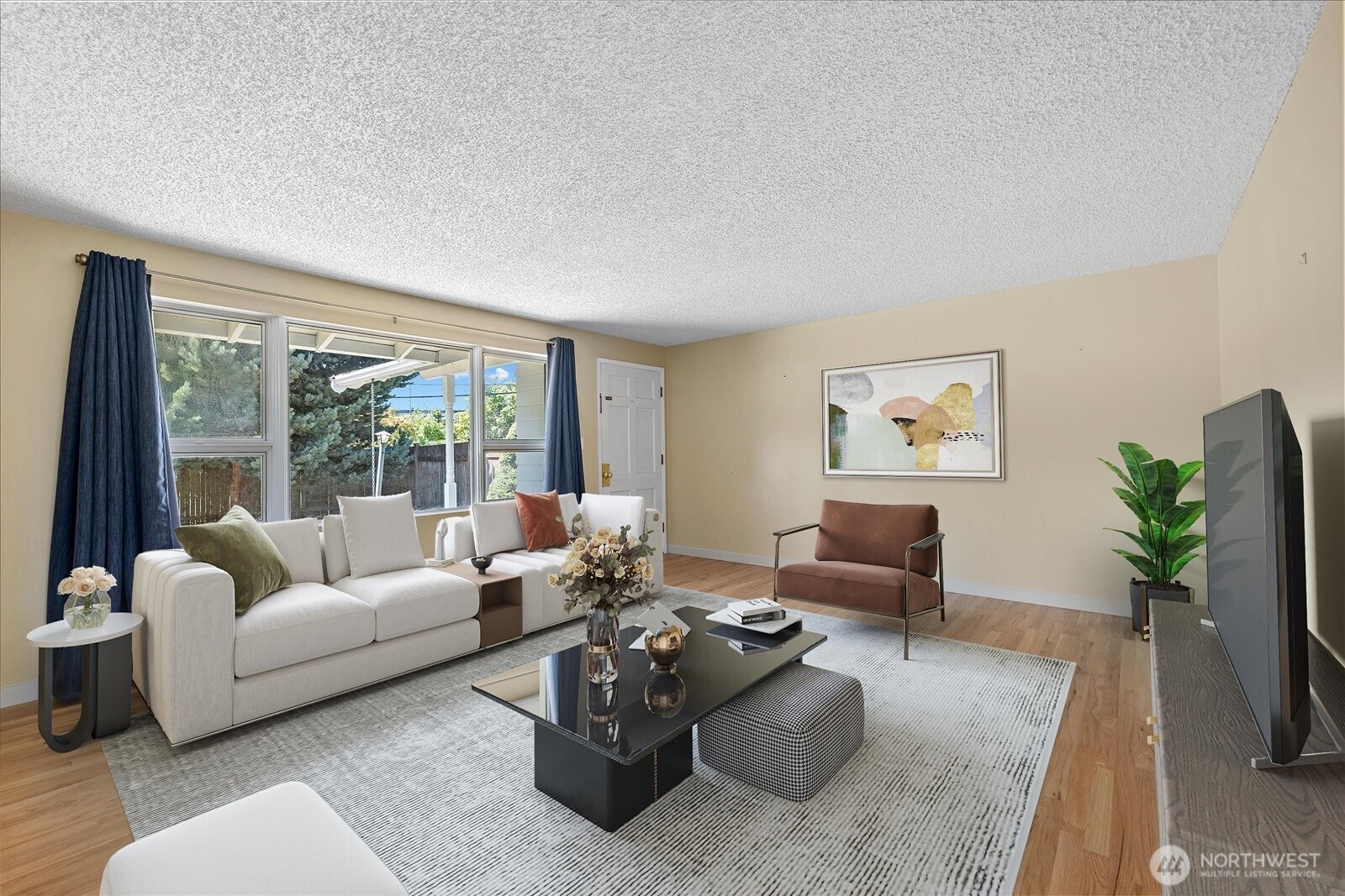 9125 Meadow Way Everett, WA 98208 - Photo 9 of 27 a living room with furniture or couch and a flat screen tv