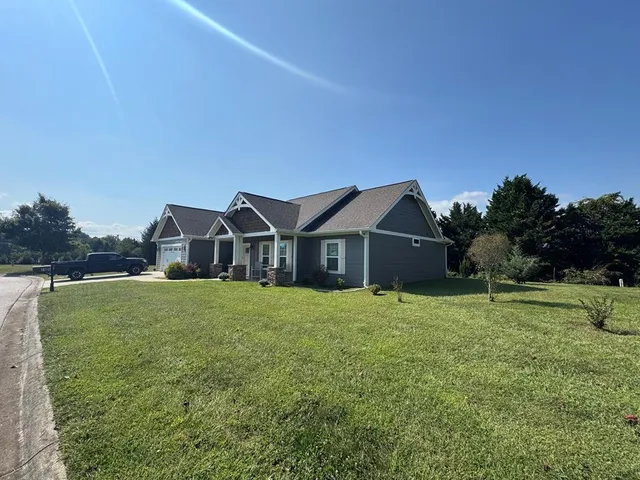 a house with trees in the background