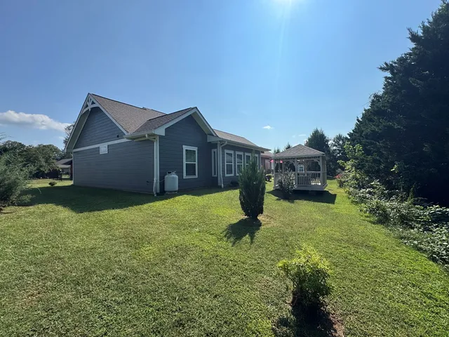 a house view with a garden space