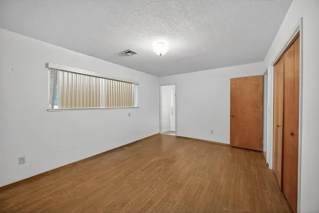a bathroom with a sink a light fixture and a mirror