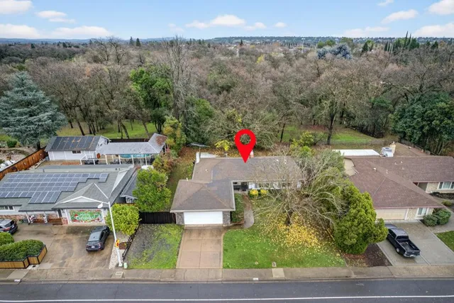 an aerial view of residential house with outdoor space