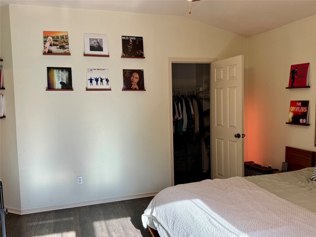 2308 Sweet Clover Drive Austin, TX 78745 - Photo 18 of 30 a bedroom with a bed and wall painting