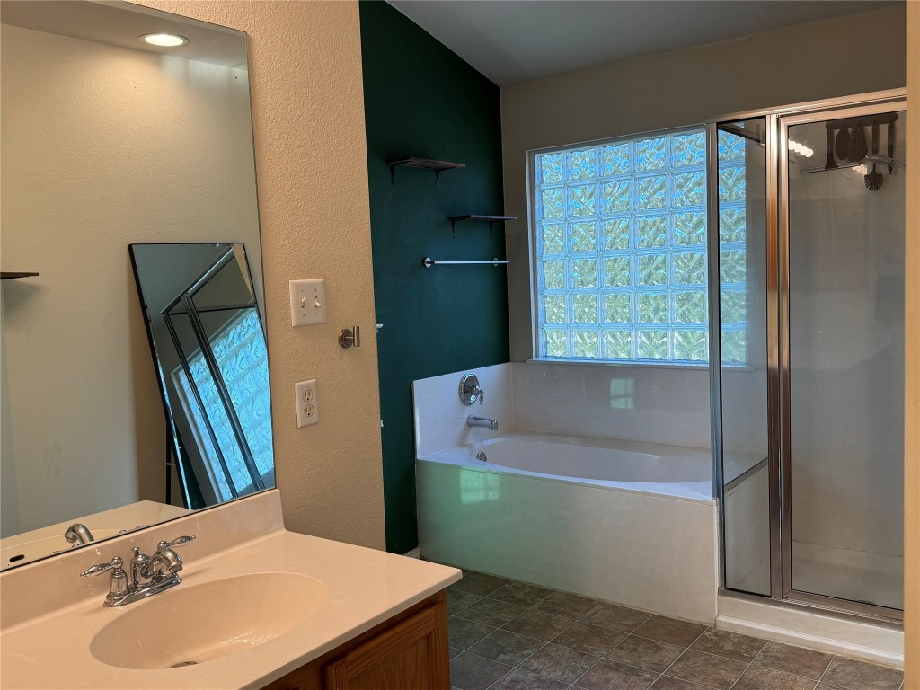 2308 Sweet Clover Drive Austin, TX 78745 - Photo 22 of 30 a bathroom with a sink and a mirror