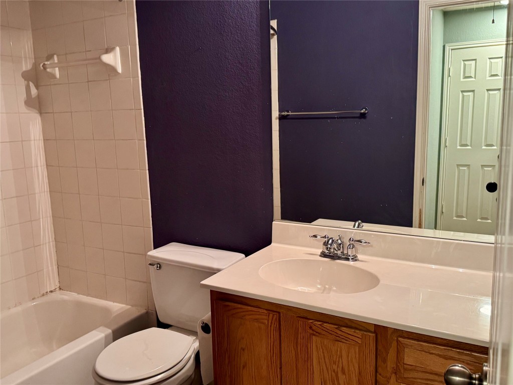 2308 Sweet Clover Drive Austin, TX 78745 - Photo 25 of 30 a bathroom with a sink toilet and shower