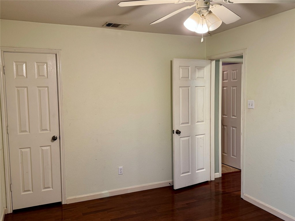 2308 Sweet Clover Drive Austin, TX 78745 - Photo 26 of 30 an empty room with wooden floor and closet