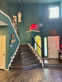 2308 Sweet Clover Drive Austin, TX 78745 - Photo 3 of 30 a view of entryway and hall with wooden floor