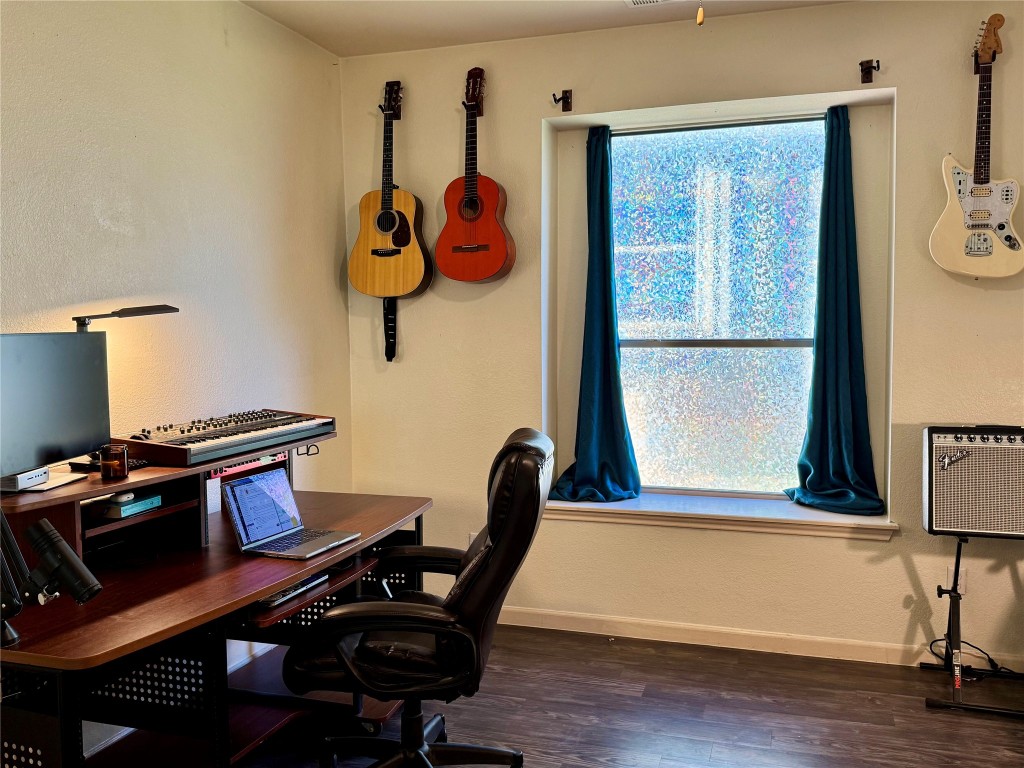 2308 Sweet Clover Drive Austin, TX 78745 - Photo 7 of 30 a view of a workspace with furniture and a window