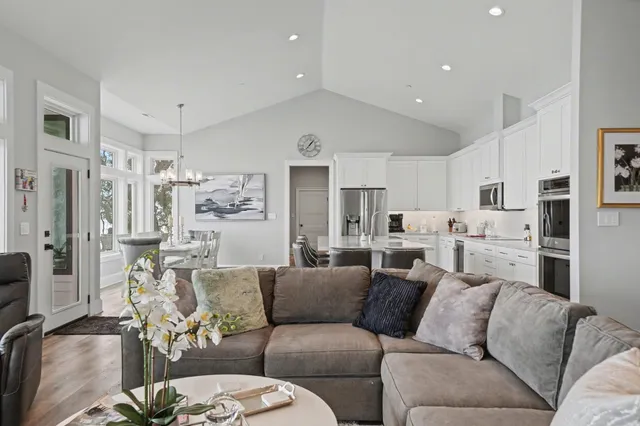 a kitchen with a sink a counter top space and stainless steel appliances