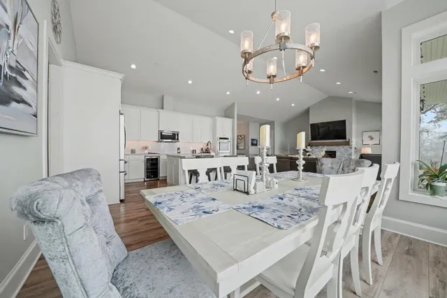 a bathroom with a granite countertop sink vanity mirror and toilet