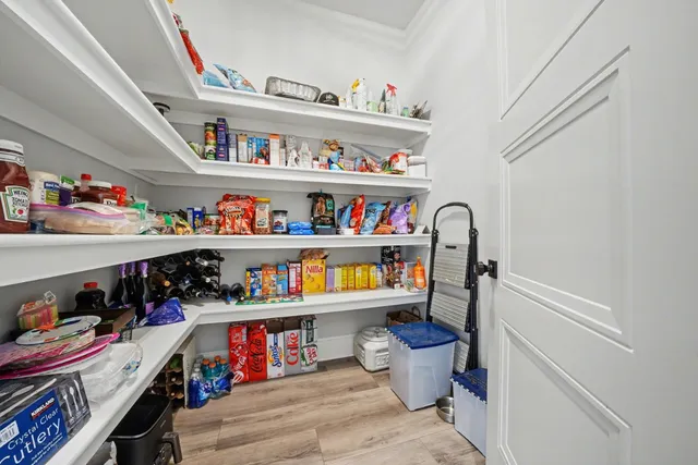 a view of storage and utility room with washer and dryer