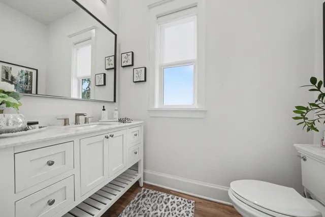 a spacious bedroom with a bed and a large window