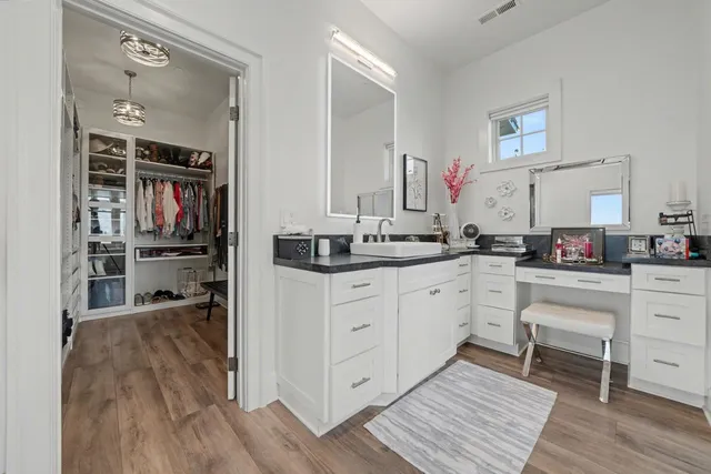 a bathroom with a glass door shower