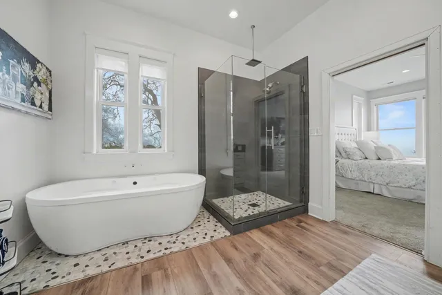 a white toilet sitting next to a bathroom sink