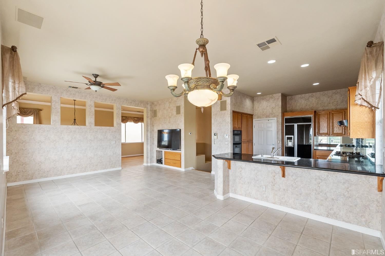 211 Sunset Court Pacifica, CA 94044 - Photo 19 of 84 an entryway in a hall with a large window and chandelier