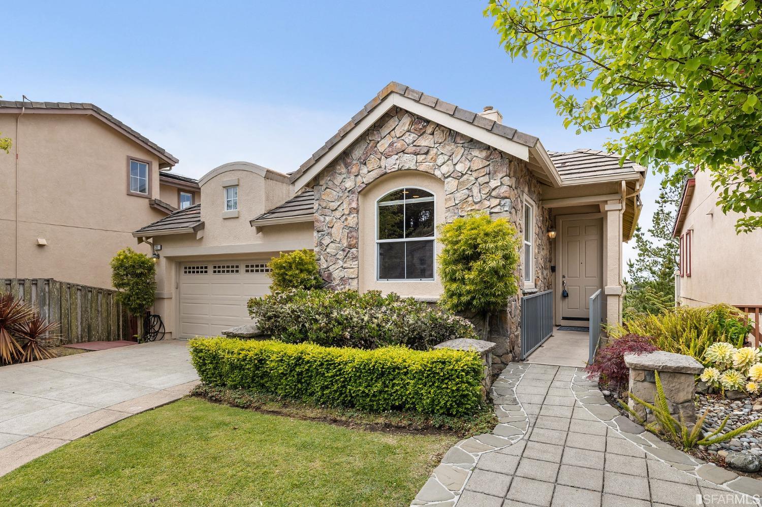 211 Sunset Court Pacifica, CA 94044 - Photo 2 of 84 a front view of a house with a yard