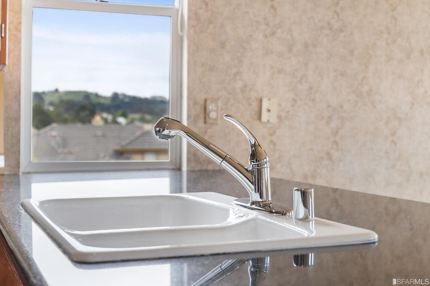 211 Sunset Court Pacifica, CA 94044 - Photo 26 of 84 a bathroom with a sink and a window