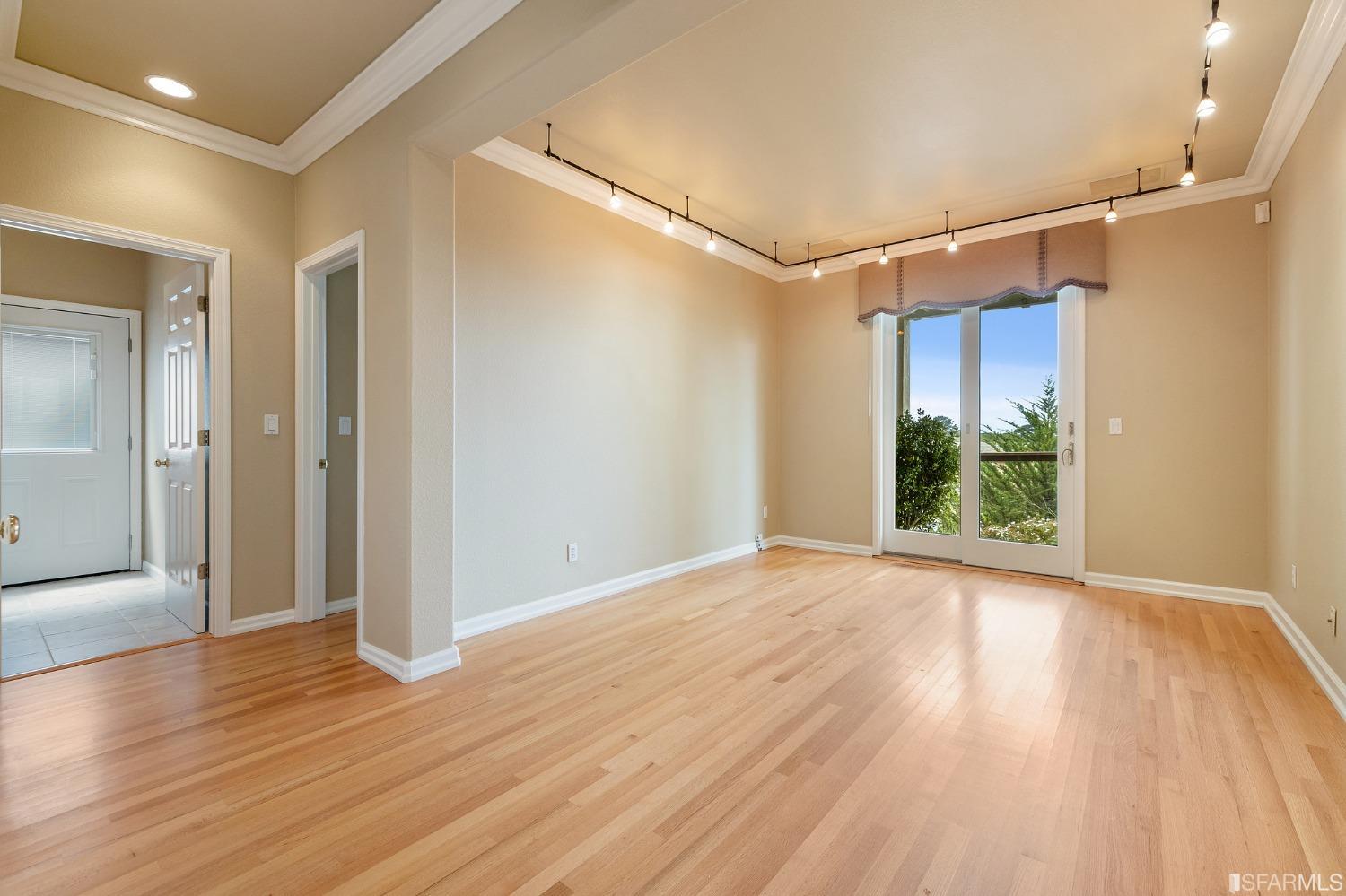 211 Sunset Court Pacifica, CA 94044 - Photo 48 of 84 a view of a room with wooden floor and windows