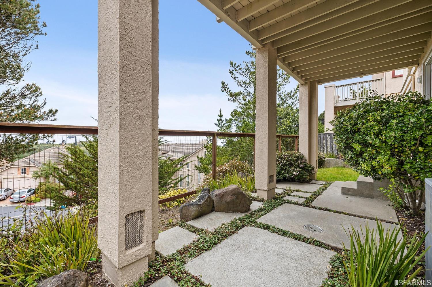 211 Sunset Court Pacifica, CA 94044 - Photo 57 of 84 a view of a patio with table and chairs and potted plants
