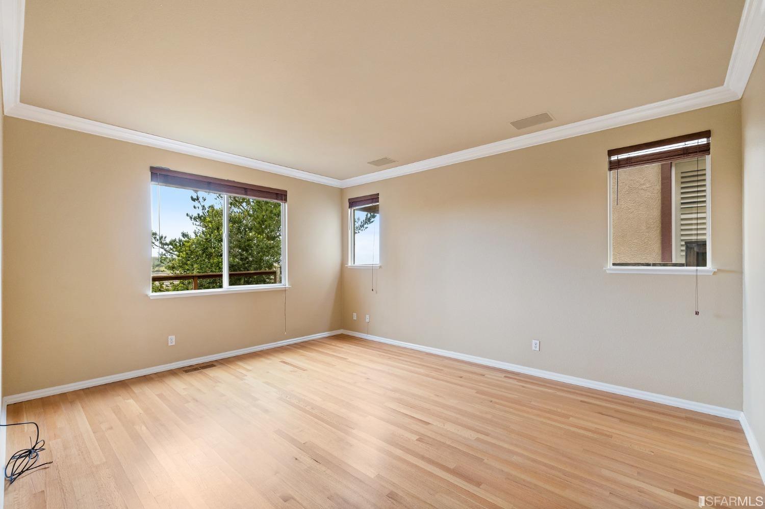 211 Sunset Court Pacifica, CA 94044 - Photo 60 of 84 a view of an empty room with wooden floor and a window