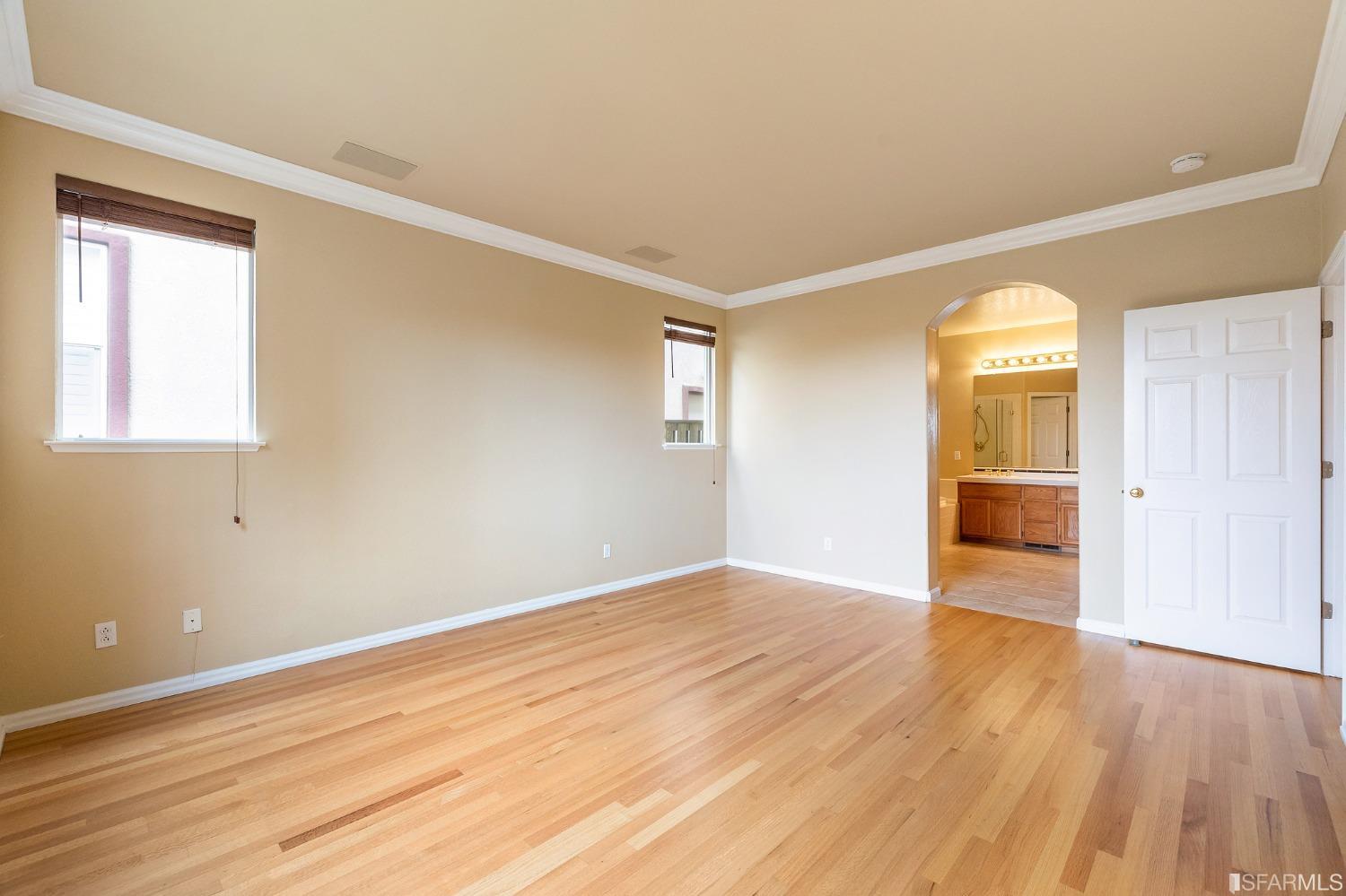 211 Sunset Court Pacifica, CA 94044 - Photo 61 of 84 an empty room with wooden floor and windows
