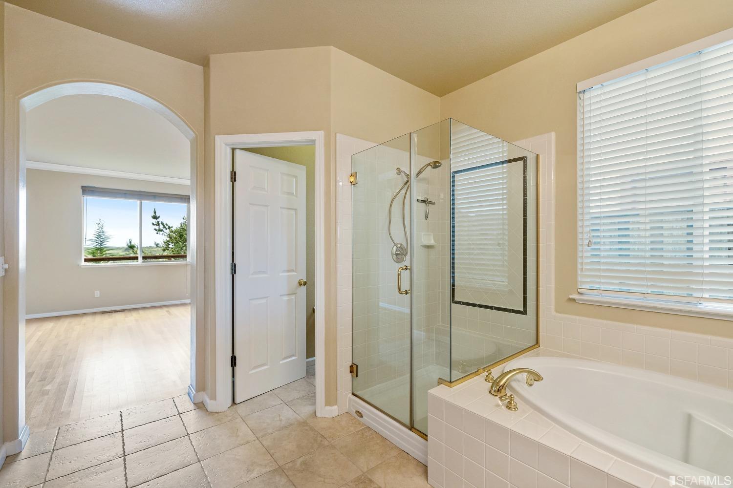 211 Sunset Court Pacifica, CA 94044 - Photo 68 of 84 a bathroom with a bathtub and a shower