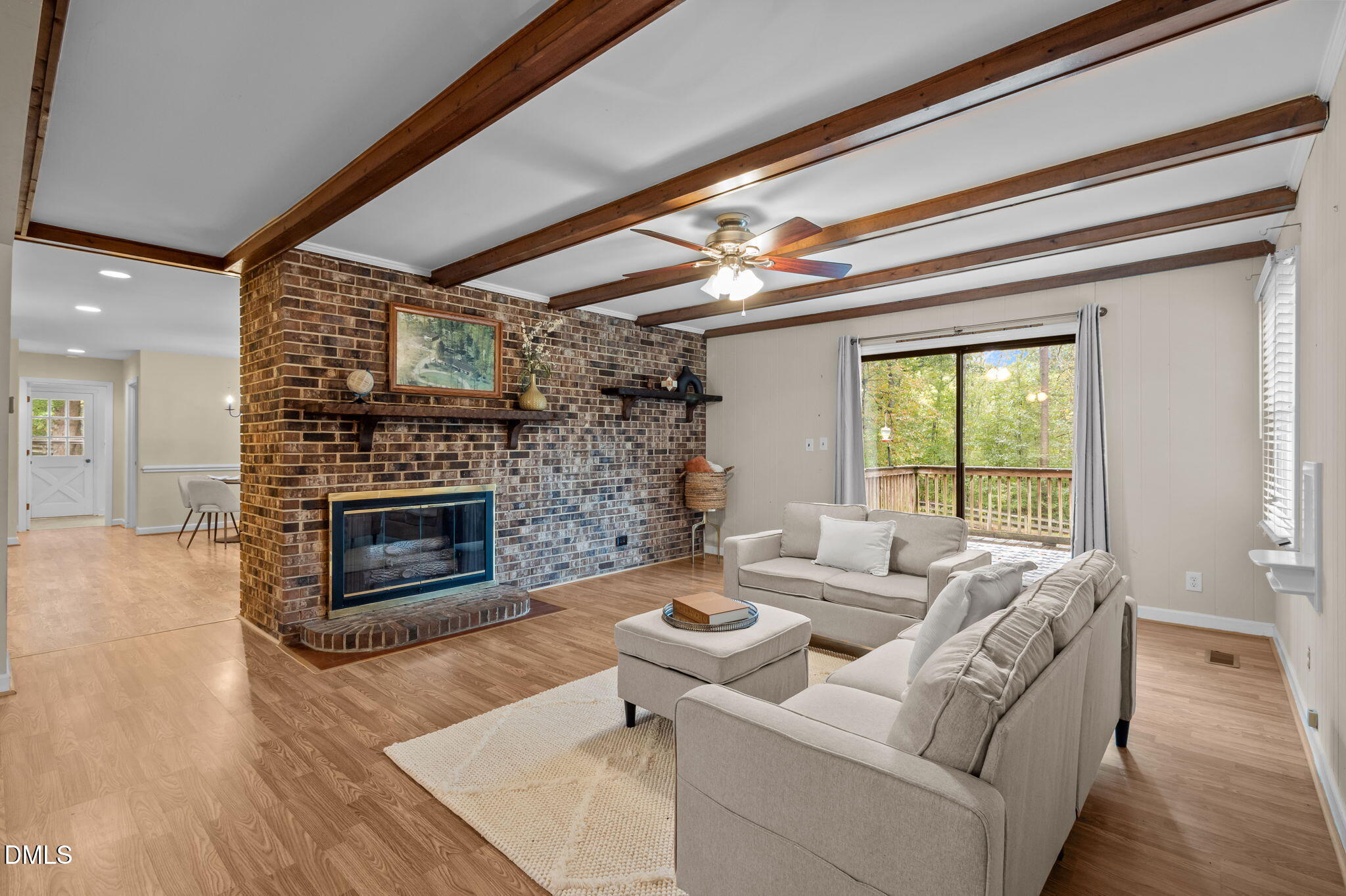 7105 Guess Road Hillsborough, NC 27278 - Photo 10 of 47 a living room with furniture a fireplace and a flat screen tv