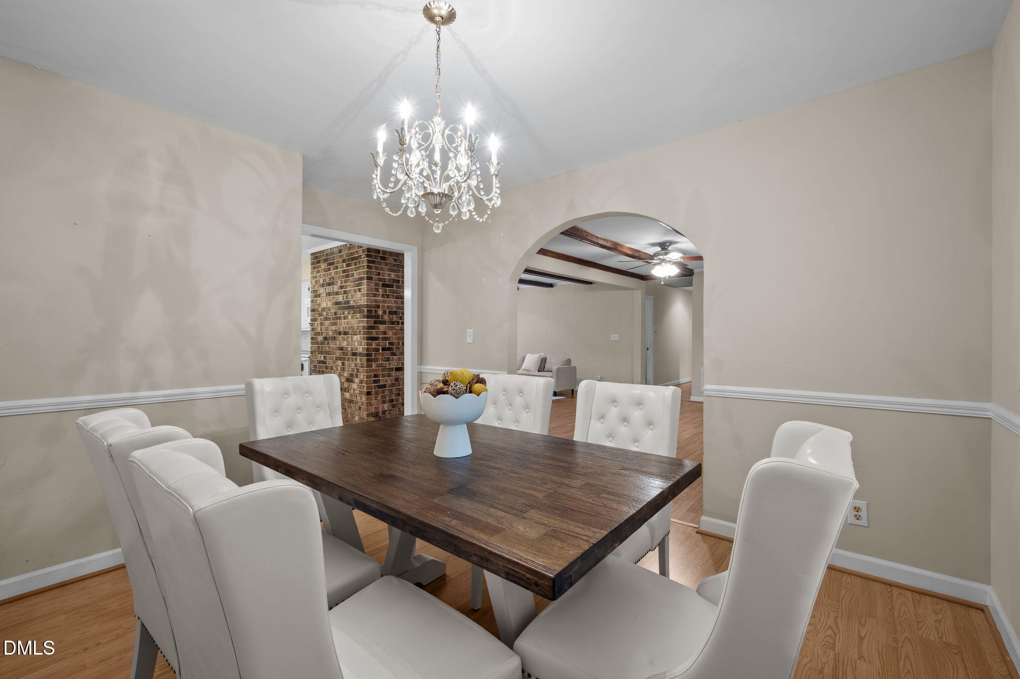 7105 Guess Road Hillsborough, NC 27278 - Photo 13 of 47 a view of a dining room with furniture a chandelier and wooden floor
