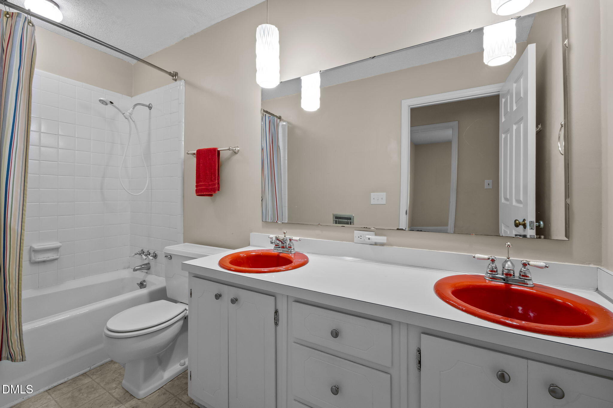7105 Guess Road Hillsborough, NC 27278 - Photo 24 of 47 a bathroom with a sink toilet and shower